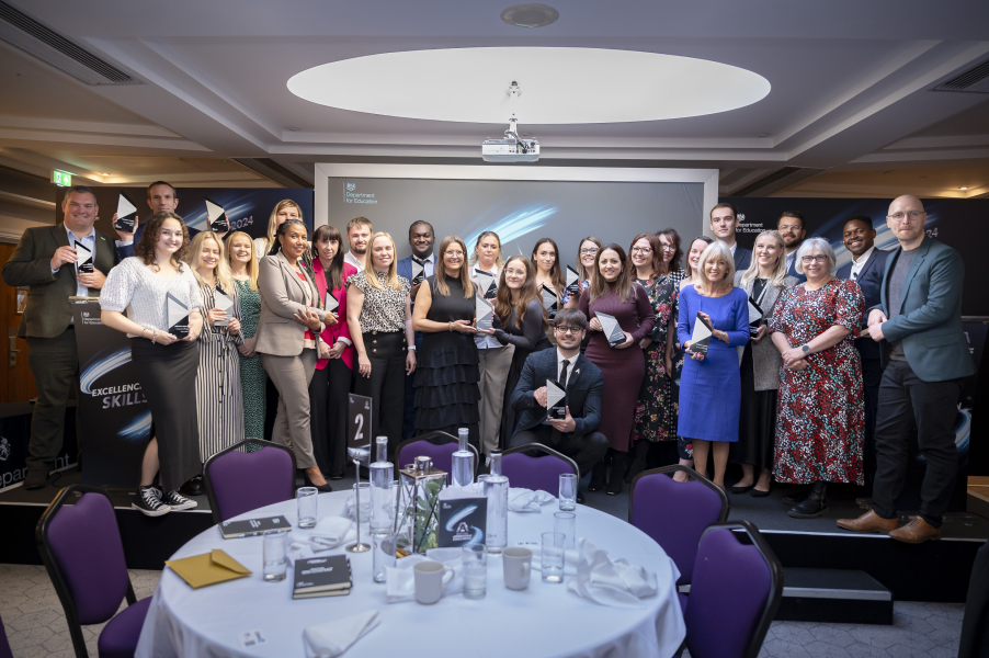 Group photo of men and women at an awards ceremony