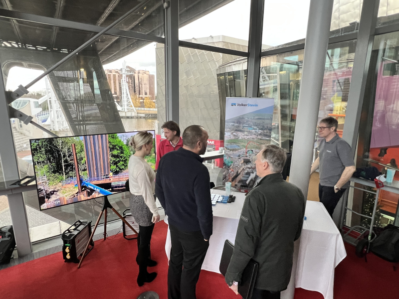 People gathered around an exhibition stand