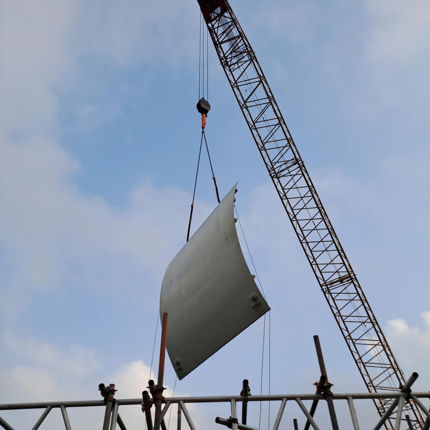 Gate being installed by a crane